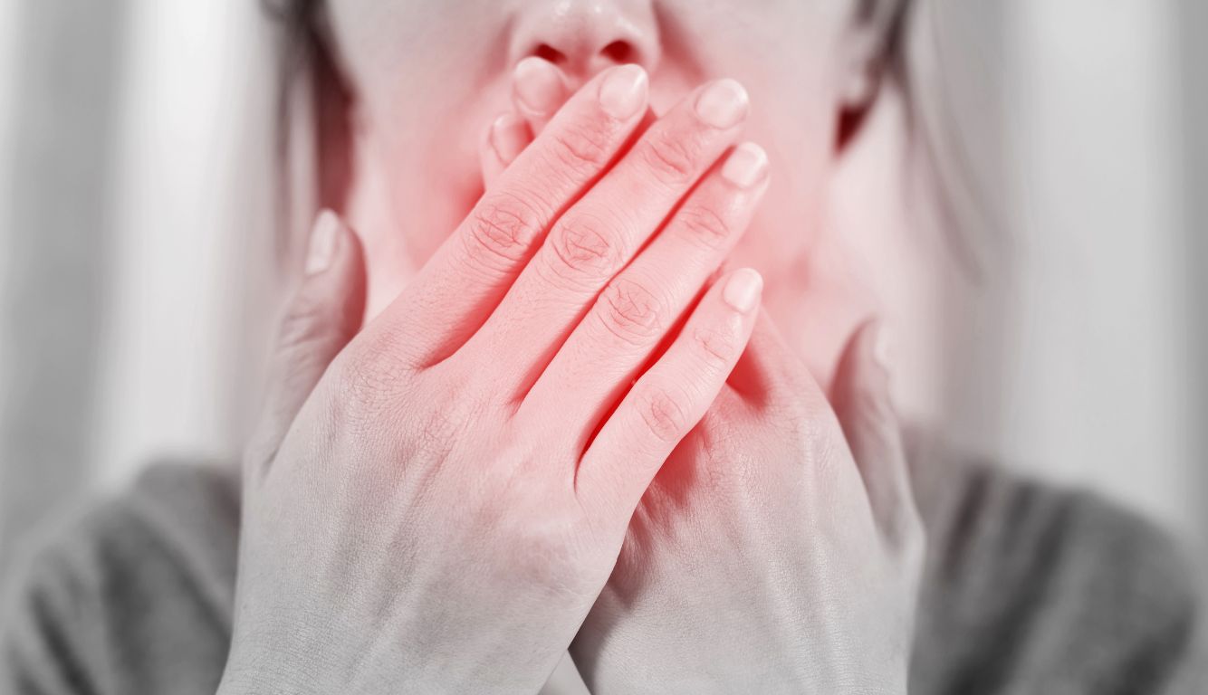 bad breath woman holding mouth with hands